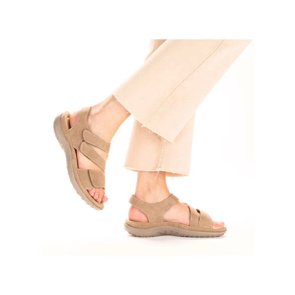 Beige and white touch fastening sandals with a soft material, cushioned sole, and stylish strap design.