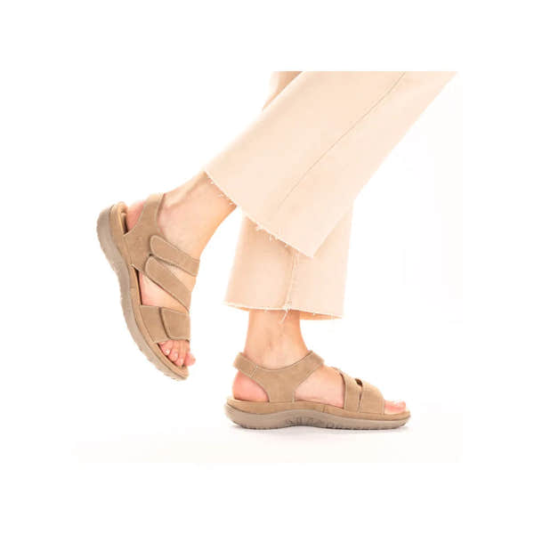 Beige and white touch fastening sandals with a soft material, cushioned sole, and stylish strap design.