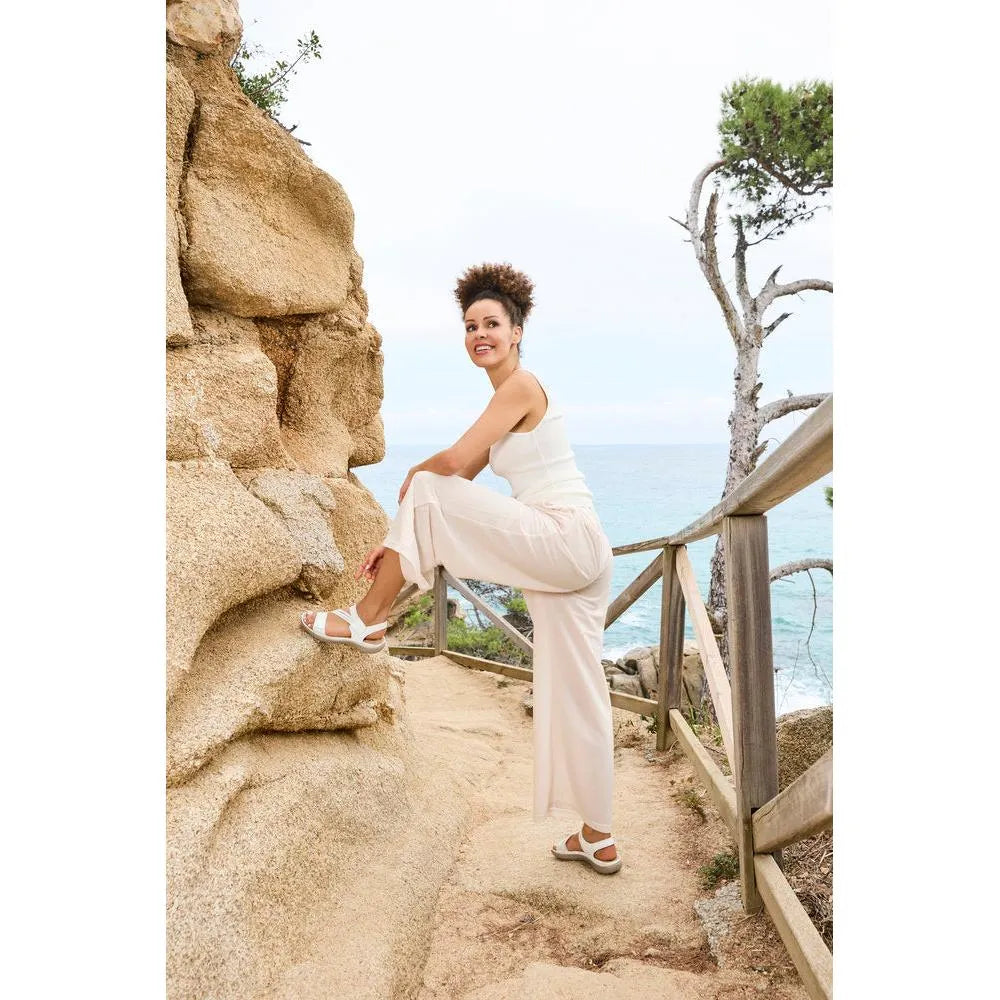 White Rieker ladies' sandals with touch fastening, featuring a sporty design, cushioned sole, and breathable material.