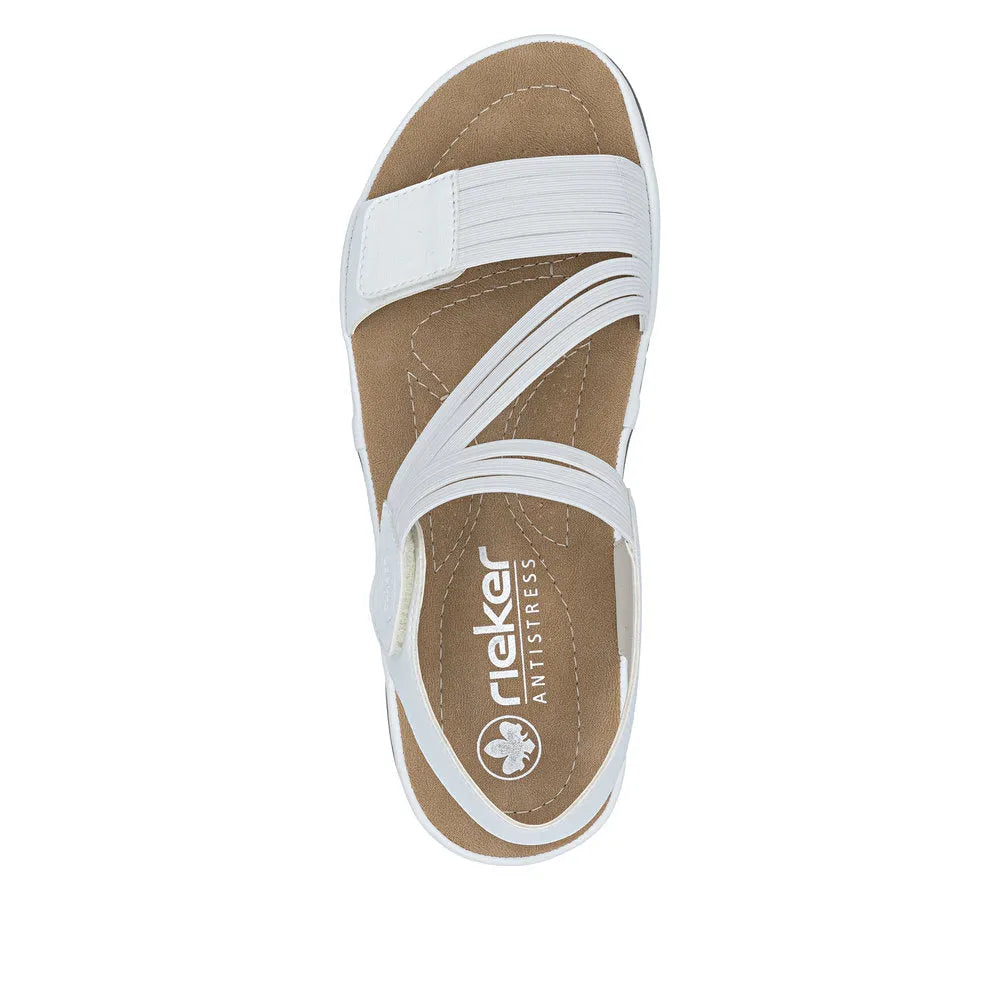 White touch-fastening sandal with synthetic straps, beige footbed, and open toe design.