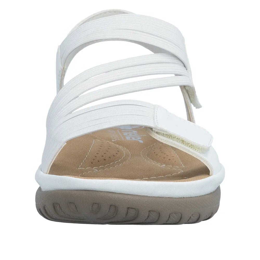 White Rieker touch-fastening sandals with elastic straps, cushioned insole, and flexible rubber sole for comfort.