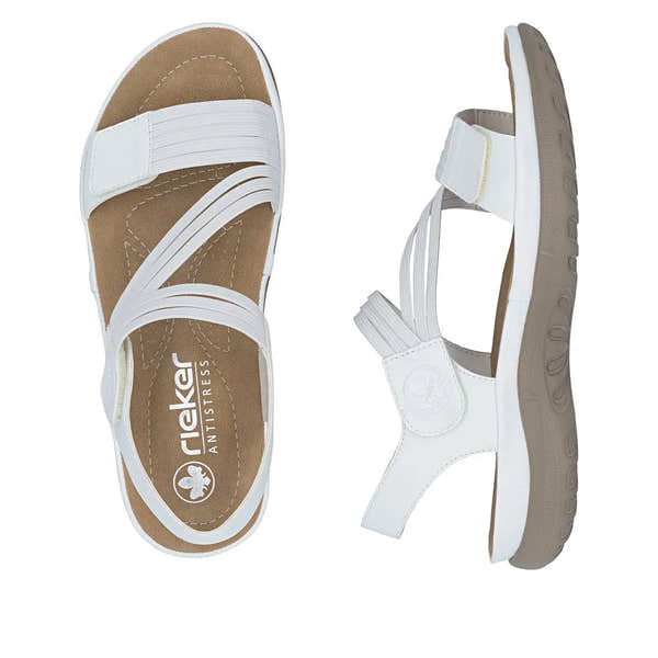 White leather touch fastening sandals with elastic straps, beige sole, and cushioned insole for women.