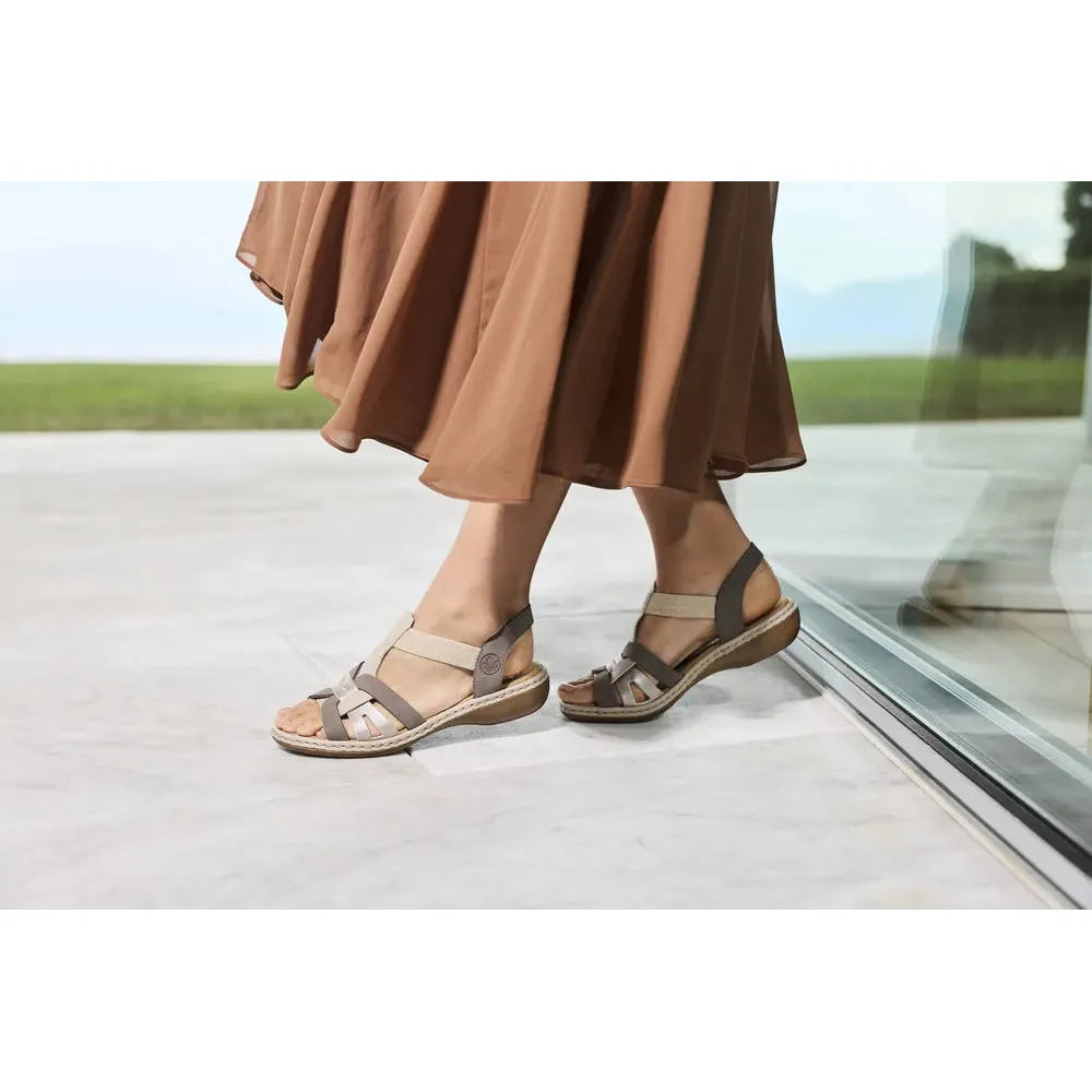 Rieker 65918-64 ladies grey/champagne elasticated sandal with wedge sole and open toe design.