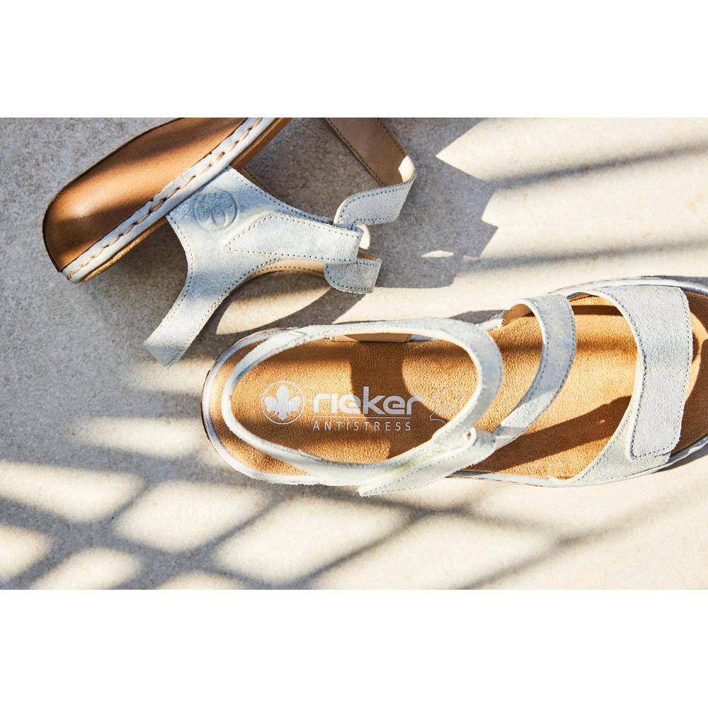 Rieker 659C7-93 women's silver leather touch fastening sandals, stylish open-toe design, cushioned insole, and comfortable fit.