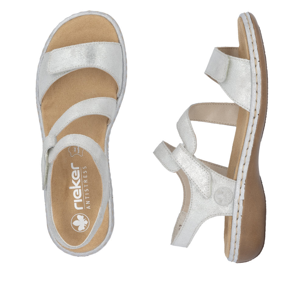 Rieker 659C7-93 women's silver leather touch fastening sandals with cushioned footbed and open toe design.