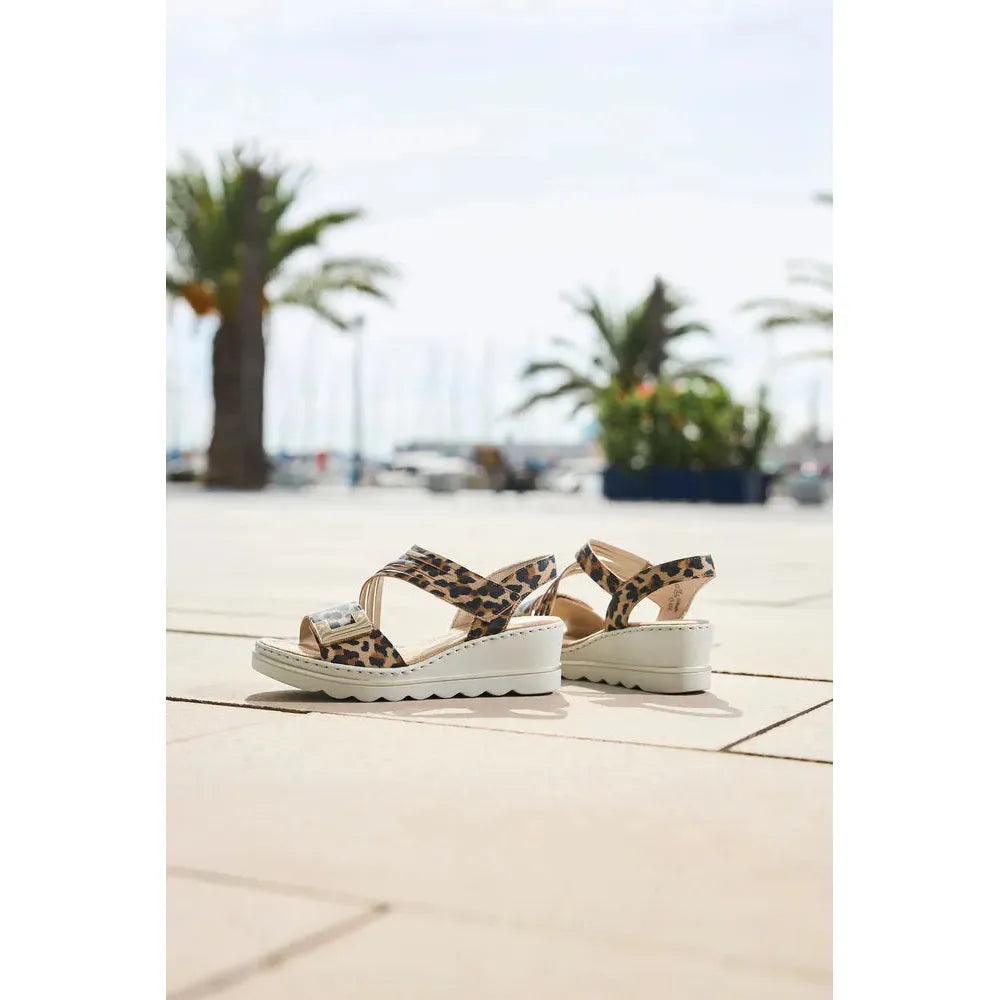 Rieker 67410-90 women's animal print touch fastening sandals with wedge heel, available for summer wear.