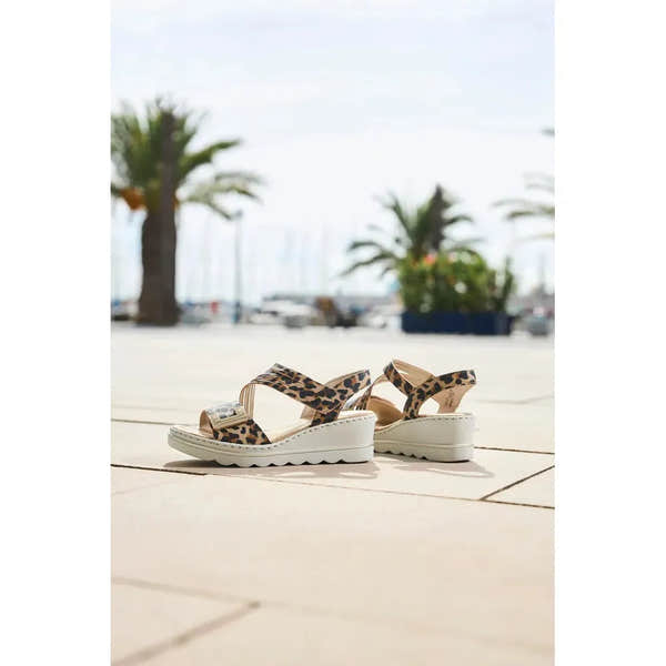 Rieker 67410-90 women's animal print touch fastening sandals with wedge heel, available for summer wear.
