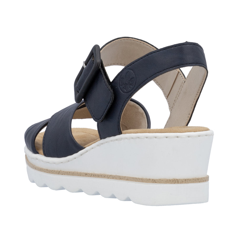 Rieker 67463-14 women's navy blue wedge sandals with buckle closure, cushioned insole, and white platform sole.
