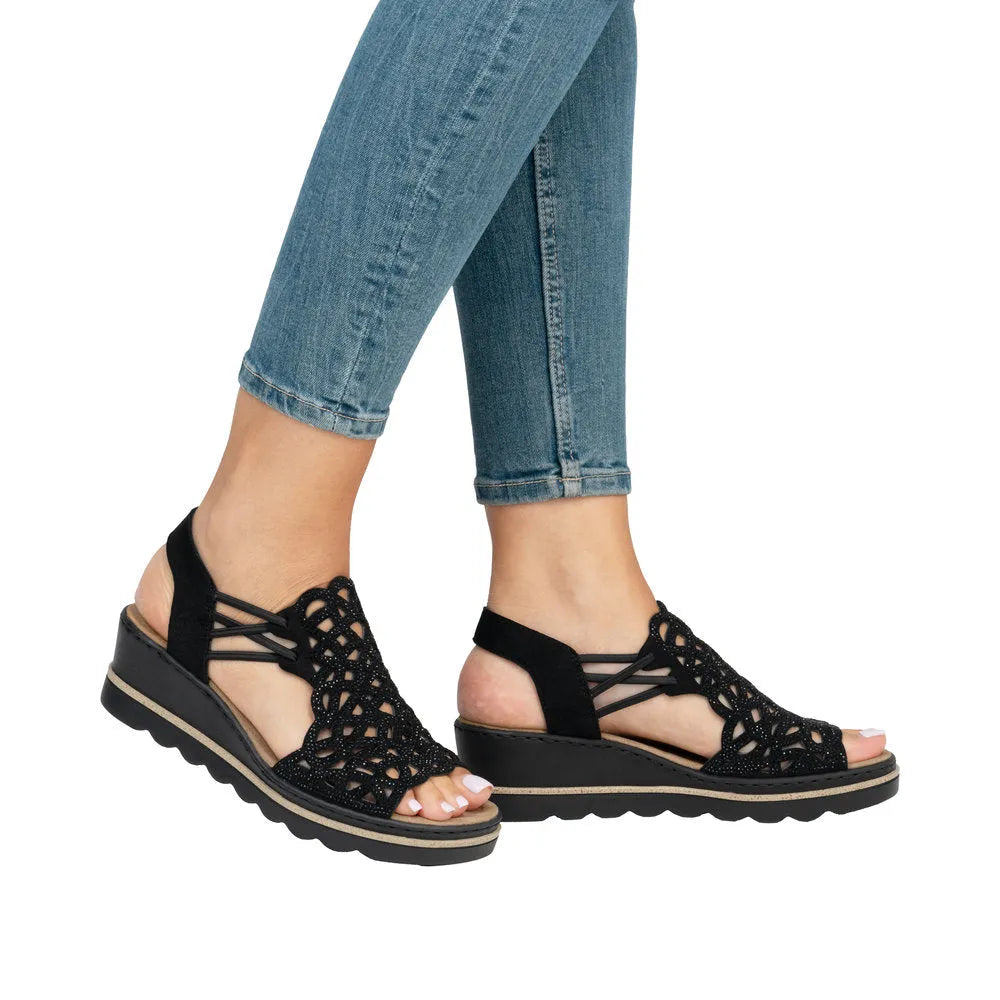 Rieker 67465-00 women's black textile elasticated sandals with cutout design and slip-on style.