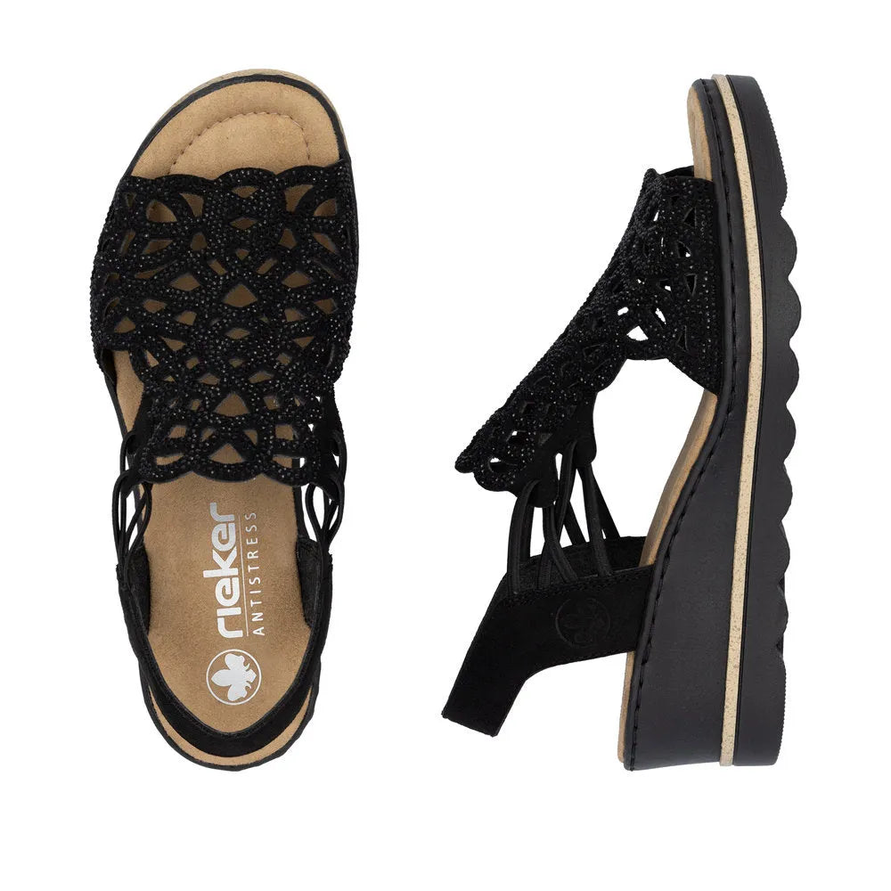 Rieker 67465-00 women's black textile elasticated sandals with intricate cutout design and cushioned insole.