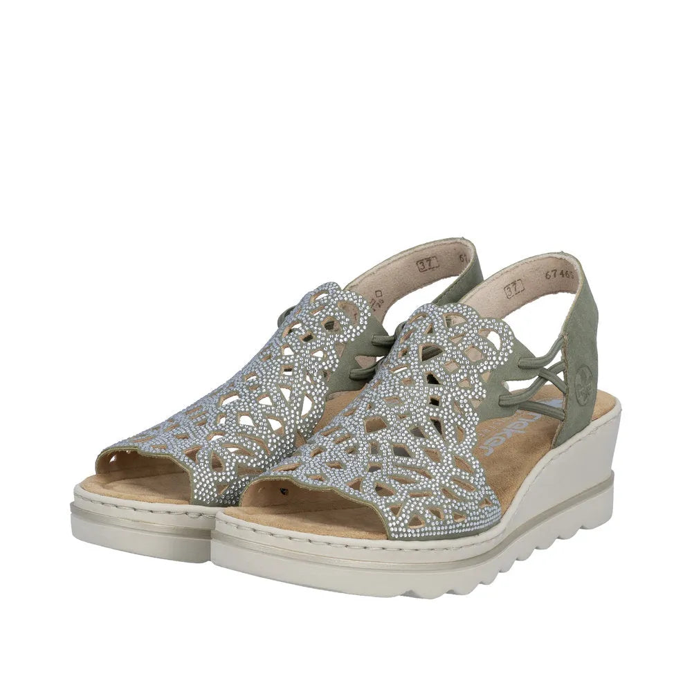 Rieker 67465-52 ladies grey elasticated sandals with intricate cut-out design and rhinestone embellishments, wedge heel, and open toe.
