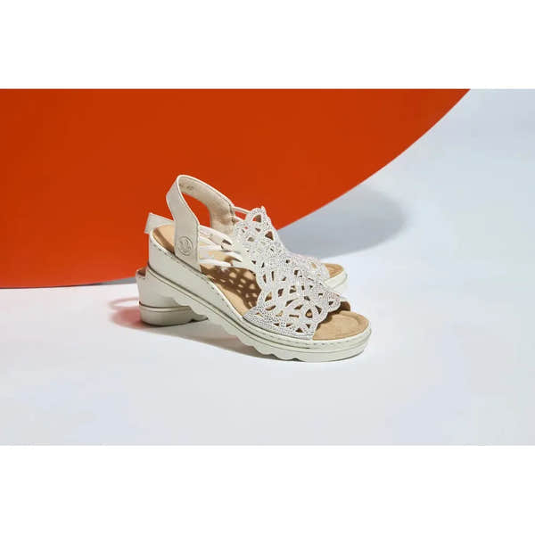 Rieker 67465-62 beige women's elasticated sandals with intricate cut-out design and cushioned sole.