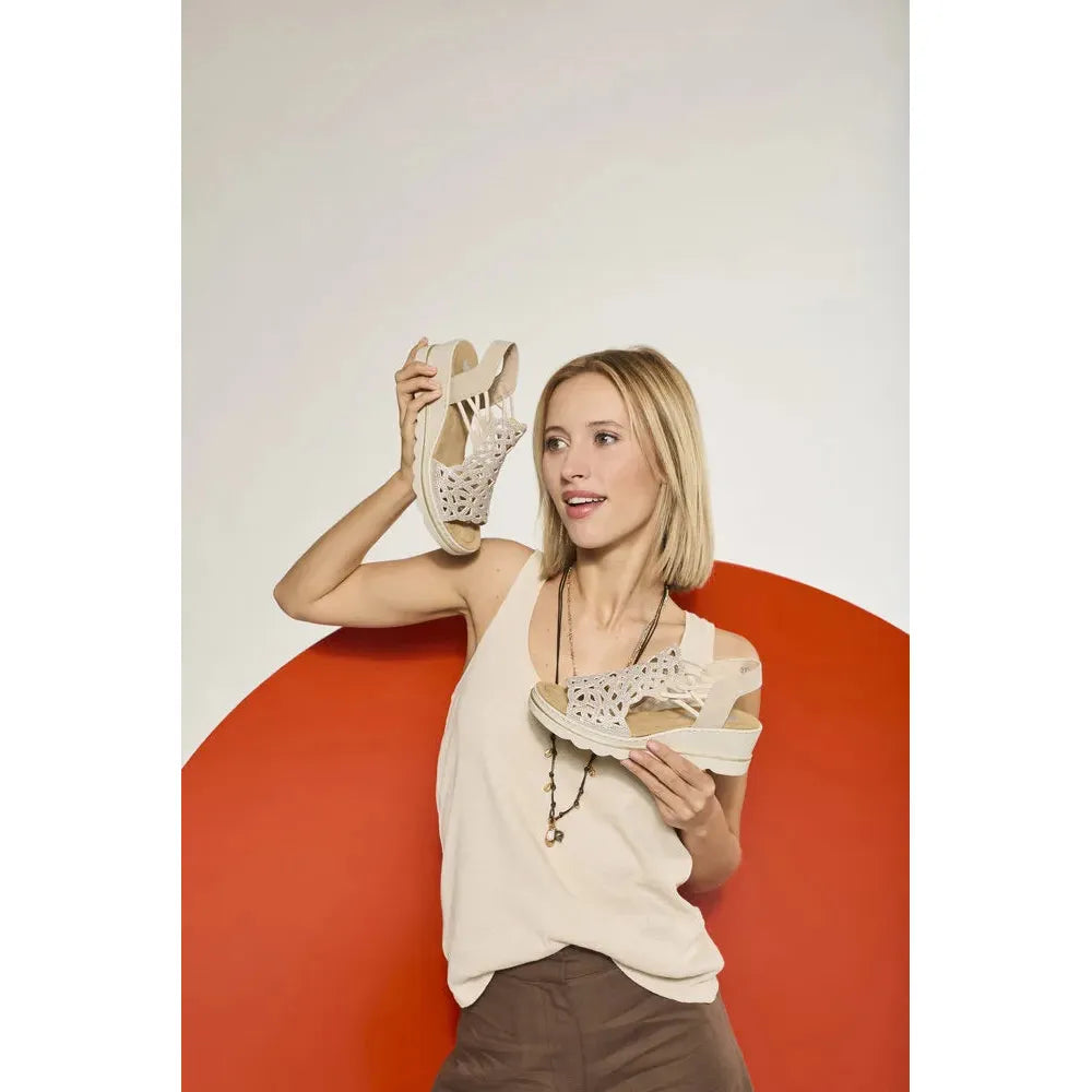 Rieker 67465-62 beige elasticated ladies' sandals, stylish open-toe design with cutout details, perfect for summer wear.