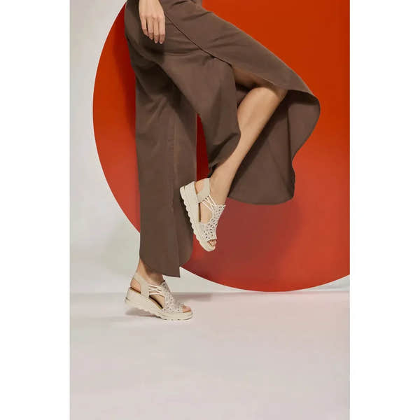 Rieker 67465-62 Ladies Beige Elasticated Sandals, open-toe slip-on summer footwear with intricate cutout design and cushioned sole.