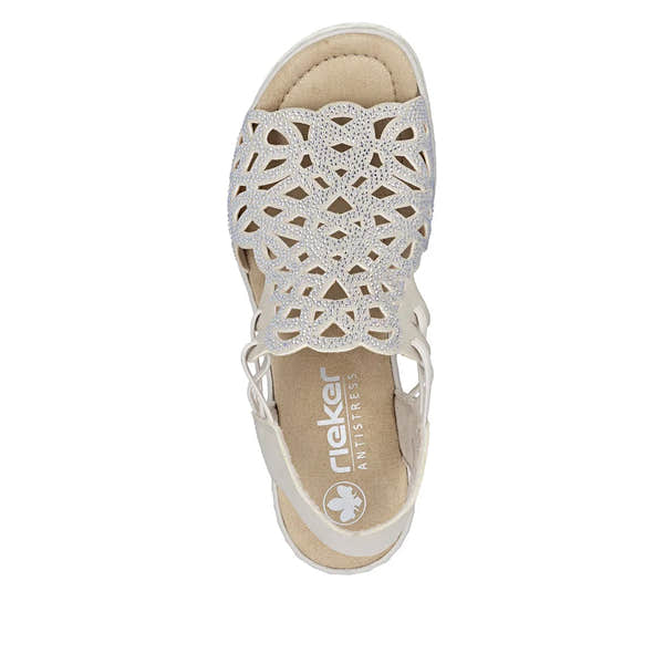 Rieker 67465-62 ladies beige elasticated slip-on sandal with intricate cutout design and embedded rhinestones.
