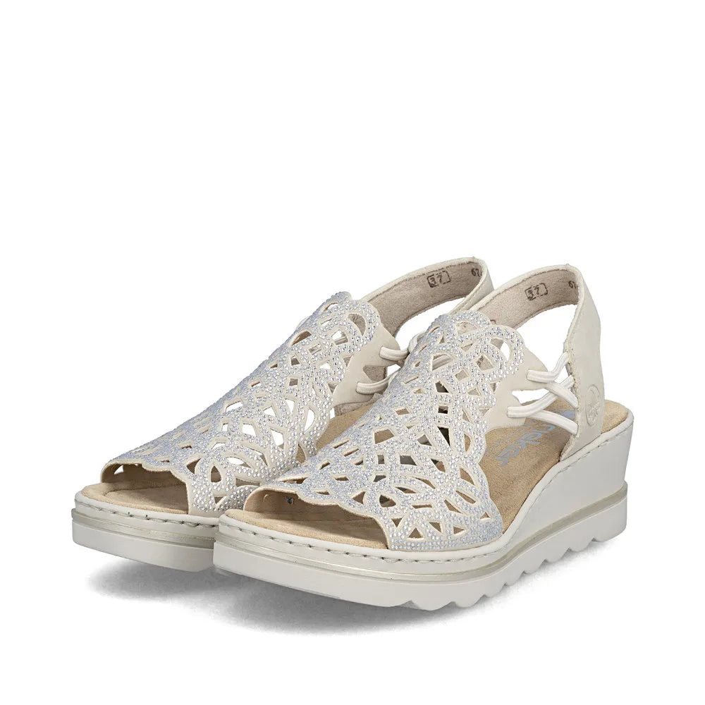 Rieker 67465-62 women's beige elasticated sandals with intricate cutout design and wedge sole.