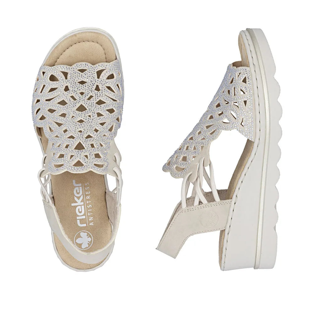 Rieker 67465-62 beige women's elasticated casual sandals with intricate cut-out design and embellished details.