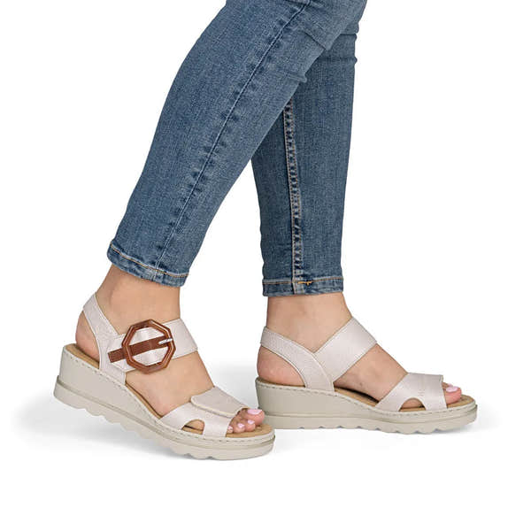Rieker 67476-91 women's off-white touch fastening sandals with adjustable ankle strap and chunky sole.
