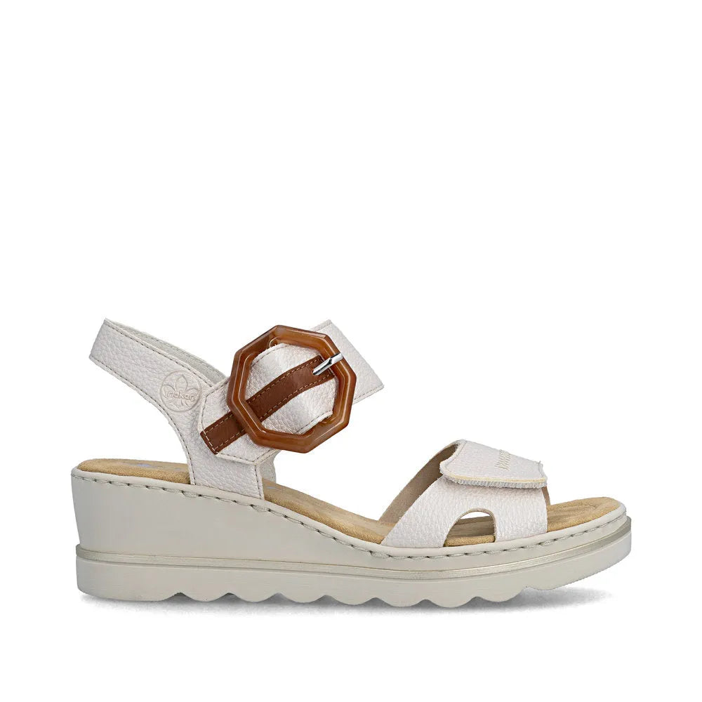 Rieker 67476-91 women's off-white touch fastening sandal with adjustable buckle strap and wedge sole.