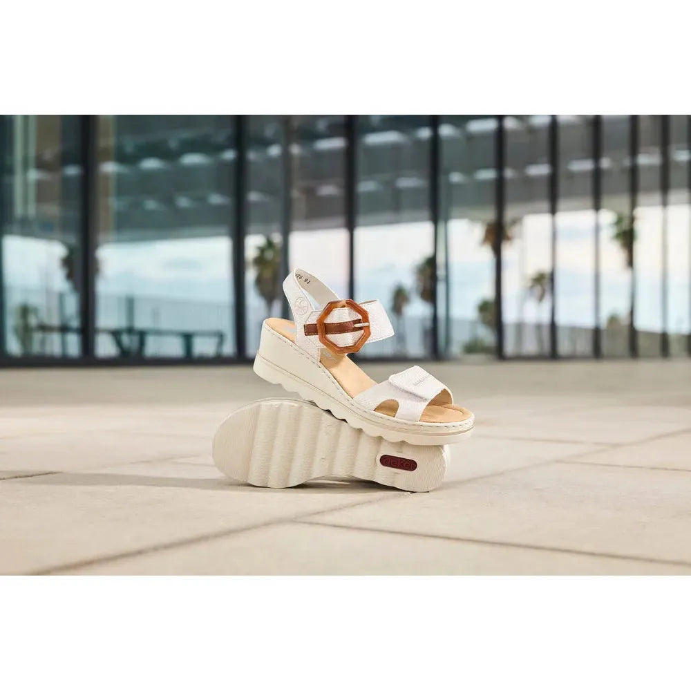 Rieker 67476-91 women's off-white touch fastening sandals with chunky sole and adjustable strap, outdoor setting.