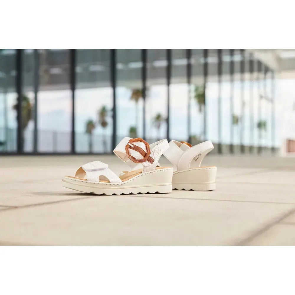 Rieker 67476-91 women's off-white touch fastening sandals with chunky wedge heels and adjustable straps.