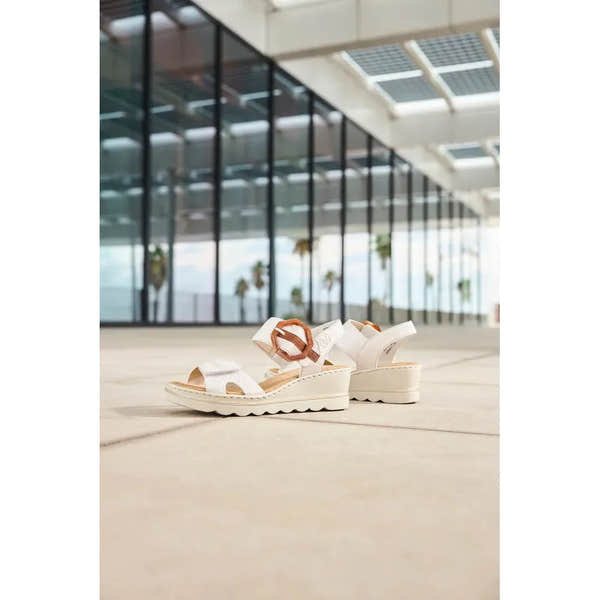 Rieker 67476-91 women's off-white touch fastening sandals with chunky mid-heel, leather straps, and adjustable buckles.