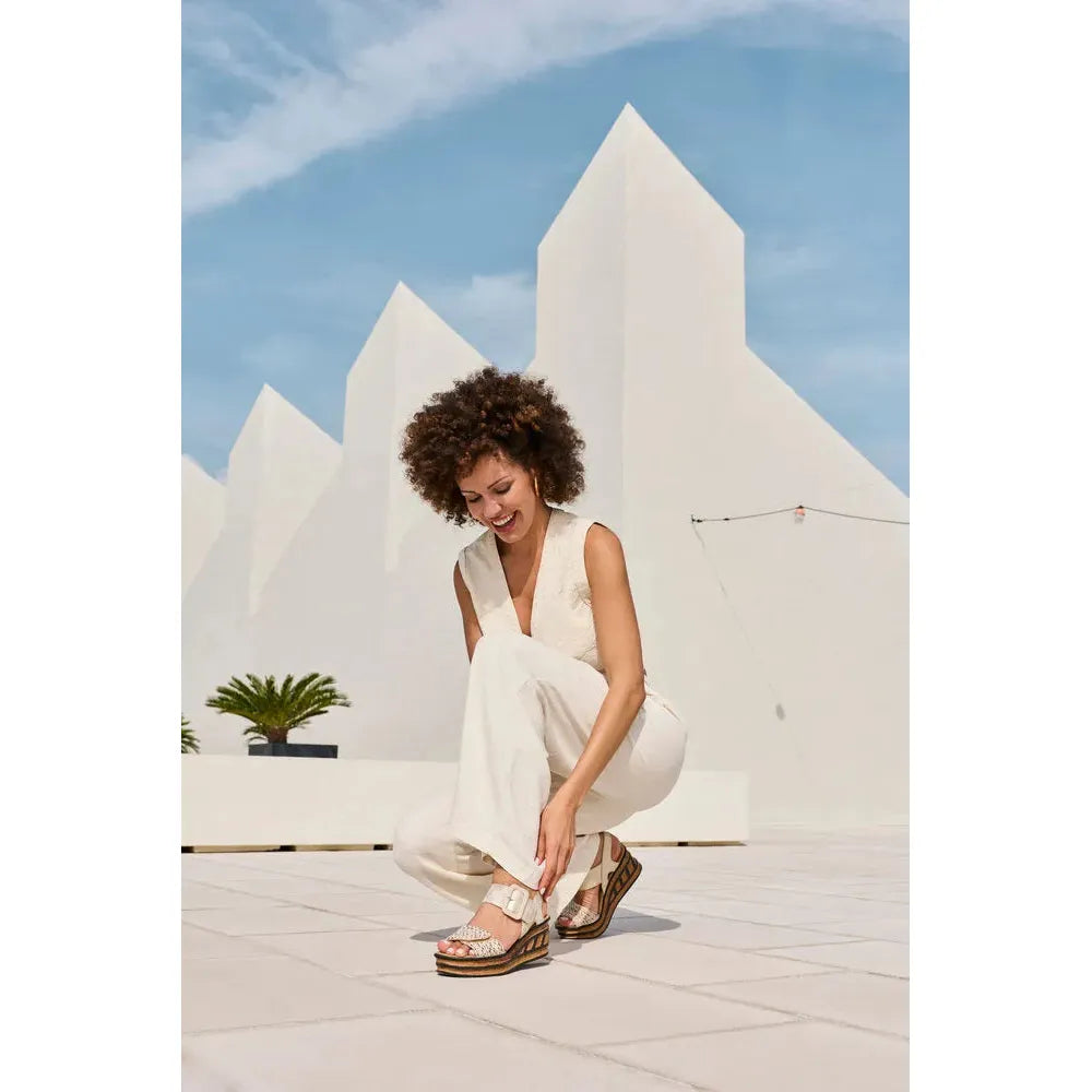 Rieker 68172-60 beige ladies touch fastening sandals, stylish summer footwear with wedge heel and open toe design.