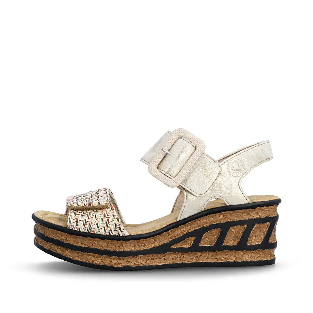 Rieker 68172-60 beige women's touch fastening wedge sandals with multi-colored woven front strap and cork platform sole.