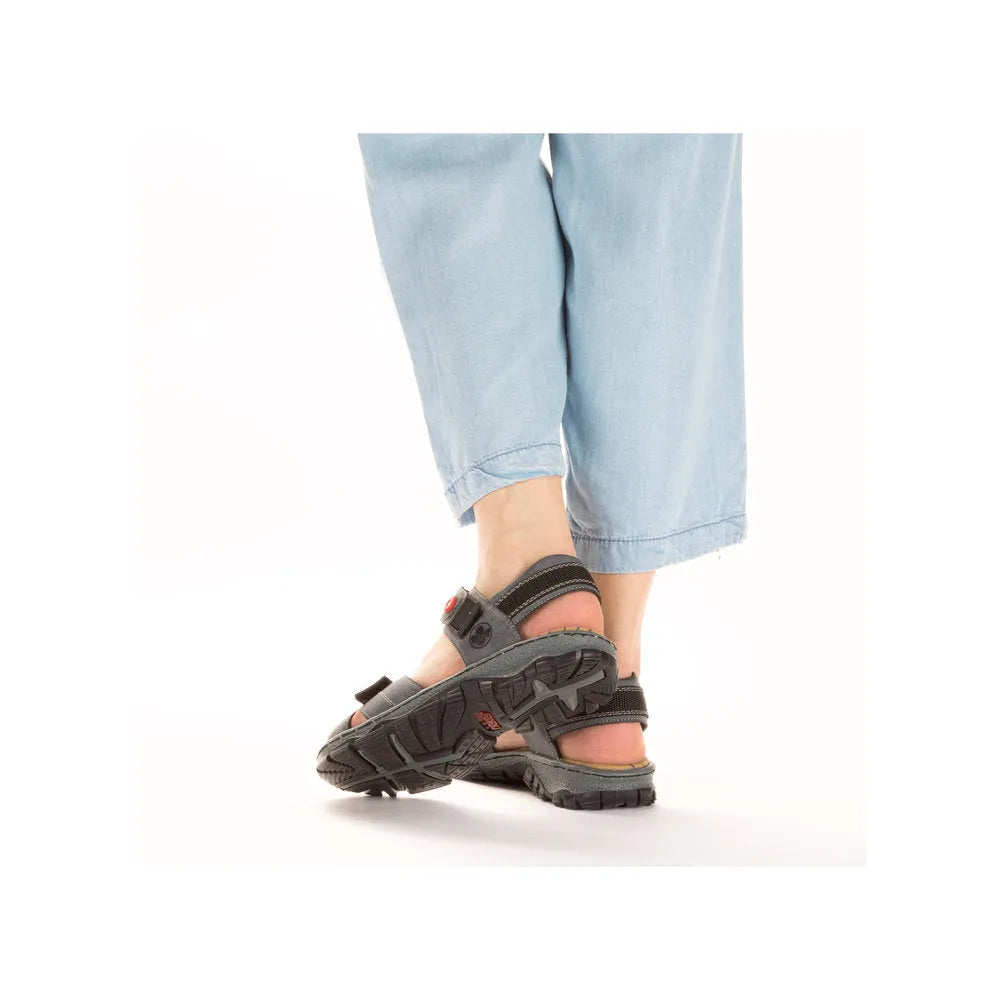 Rieker 68851-14 Ladies blue touch fastening sandals with chunky black soles and adjustable straps.