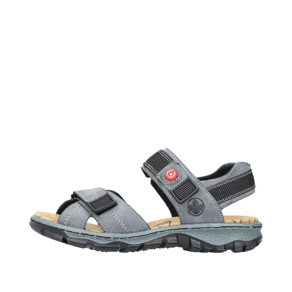 Rieker 68851-14 women's blue touch fastening sandals with adjustable straps, cushioned sole, and rugged outdoor sole.