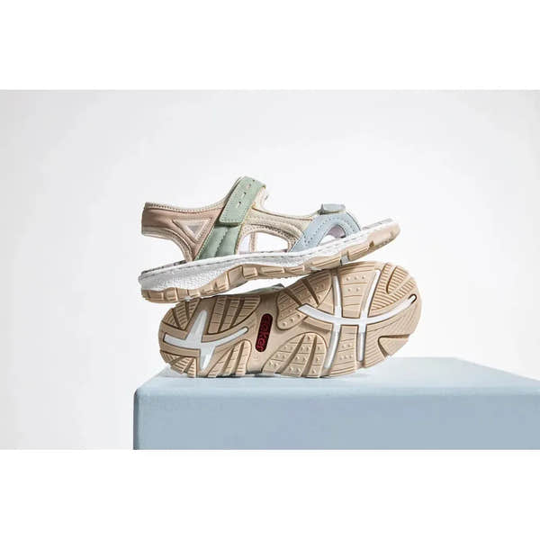 Rieker 68866-94 women's multi-touch fastening sandals with beige, pastel green, and blue straps, cushioned sole, and textured rubber outsole.