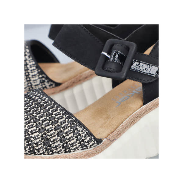 Rieker 69176-00 women's black buckle sandals with woven fabric upper and cushioned insole.
