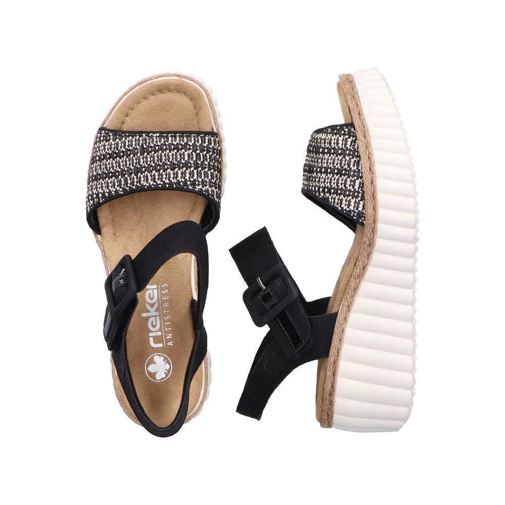 Rieker 69176-00 women's black buckle sandals with textile straps, cushioned footbed, and ribbed white sole for comfort.