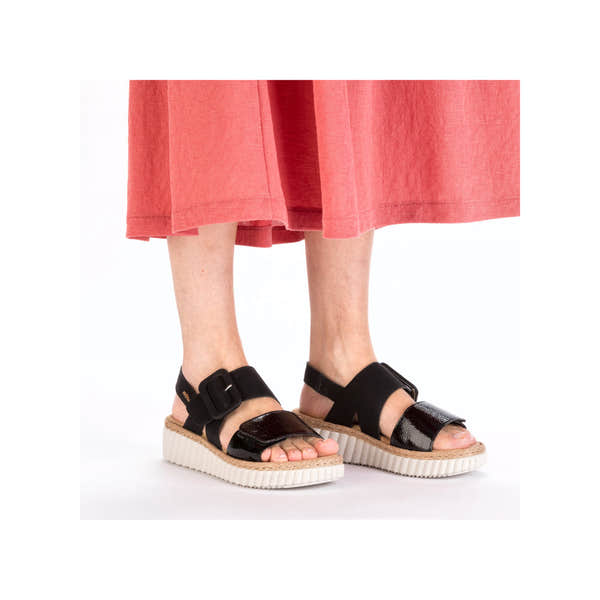 Rieker 69260-00 women's wide black buckle sandals with open toe and striped sole.