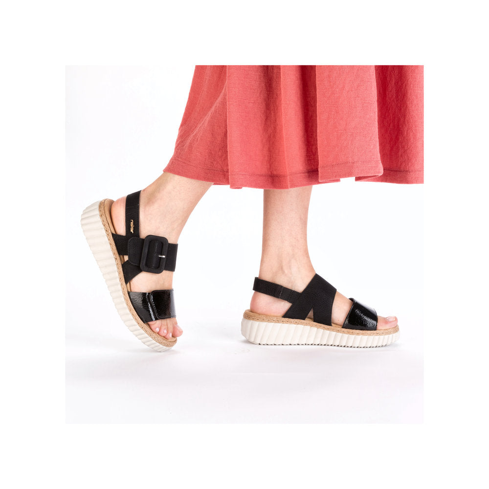 Rieker 69260-00 women's wide black buckle sandals with thick platform sole and open toe design.