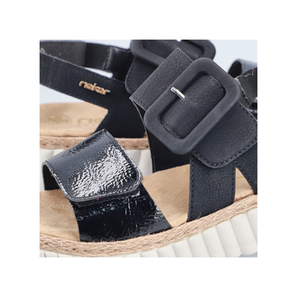 Rieker 69260-00 women's wide black buckle sandals with textured straps and cushioned footbed.