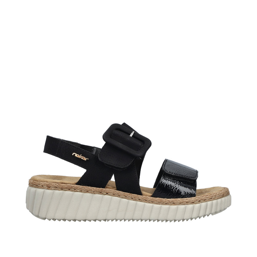 Rieker 69260-00 ladies wide black buckle sandals with cushioned insole and chunky white sole.