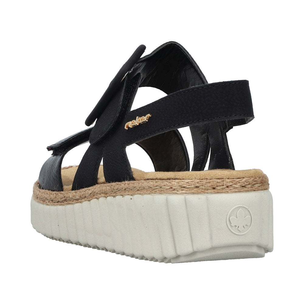 Rieker 69260-00 women's wide black buckle sandals with cushioned footbed and chunky white platform sole.