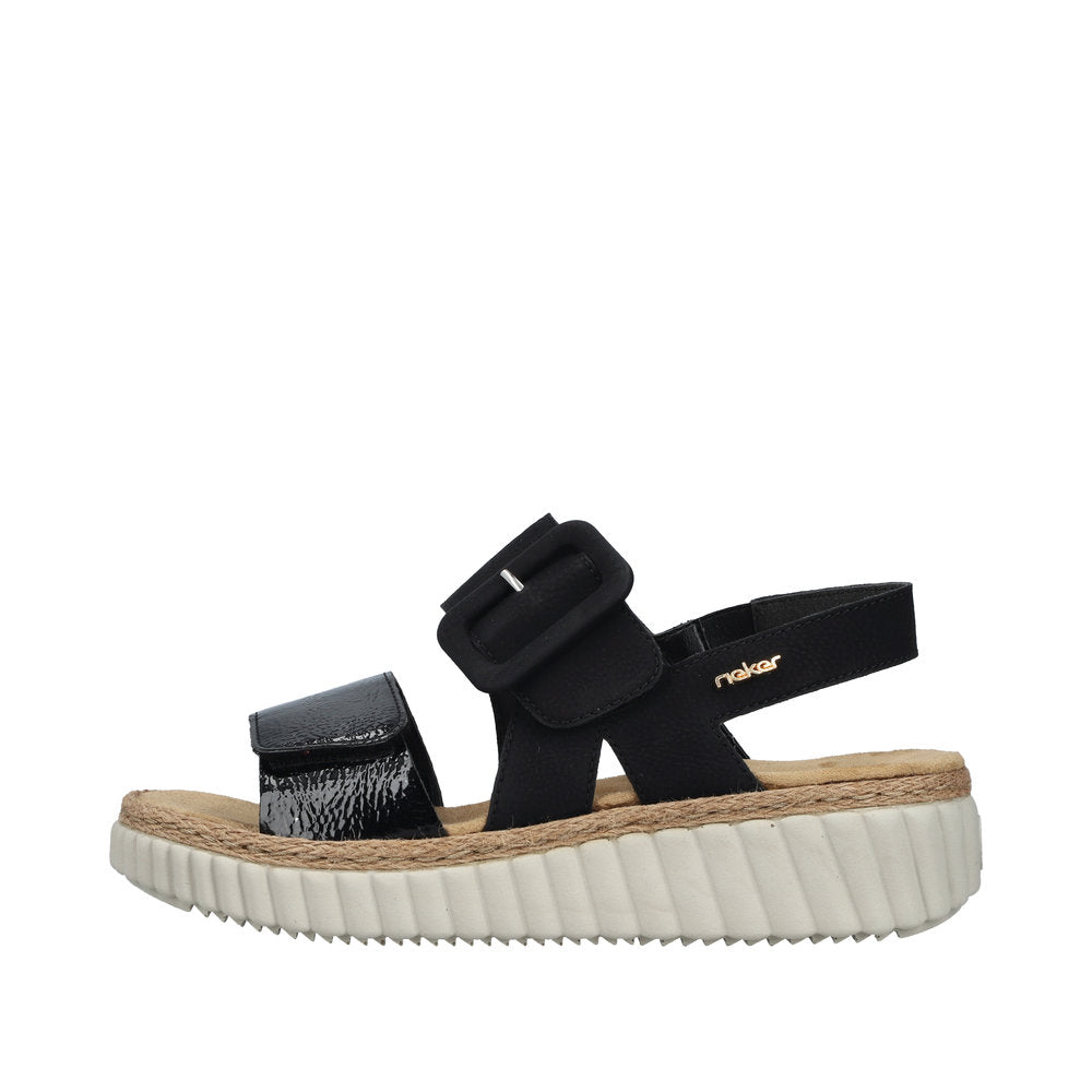 Rieker 69260-00 women's wide-fit black buckle sandals with cushioned footbed and chunky white sole.