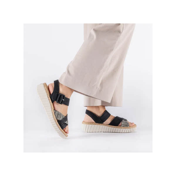 Rieker 69269-00 women's wide black touch fastening sandals with patterned toe strap and chunky sole.