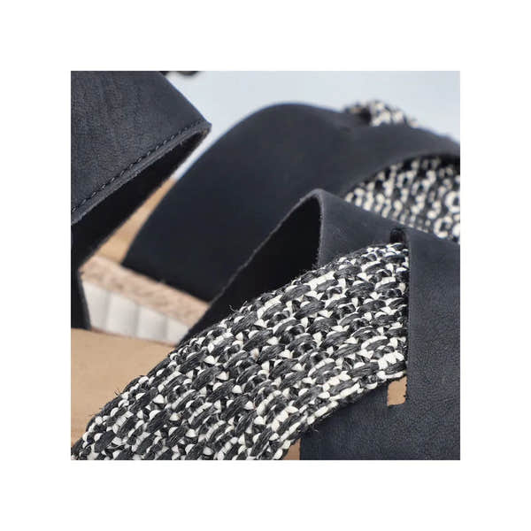 Rieker 69269-00 women's wide-fit black touch fastening sandals with woven black and white straps and cushioned sole.