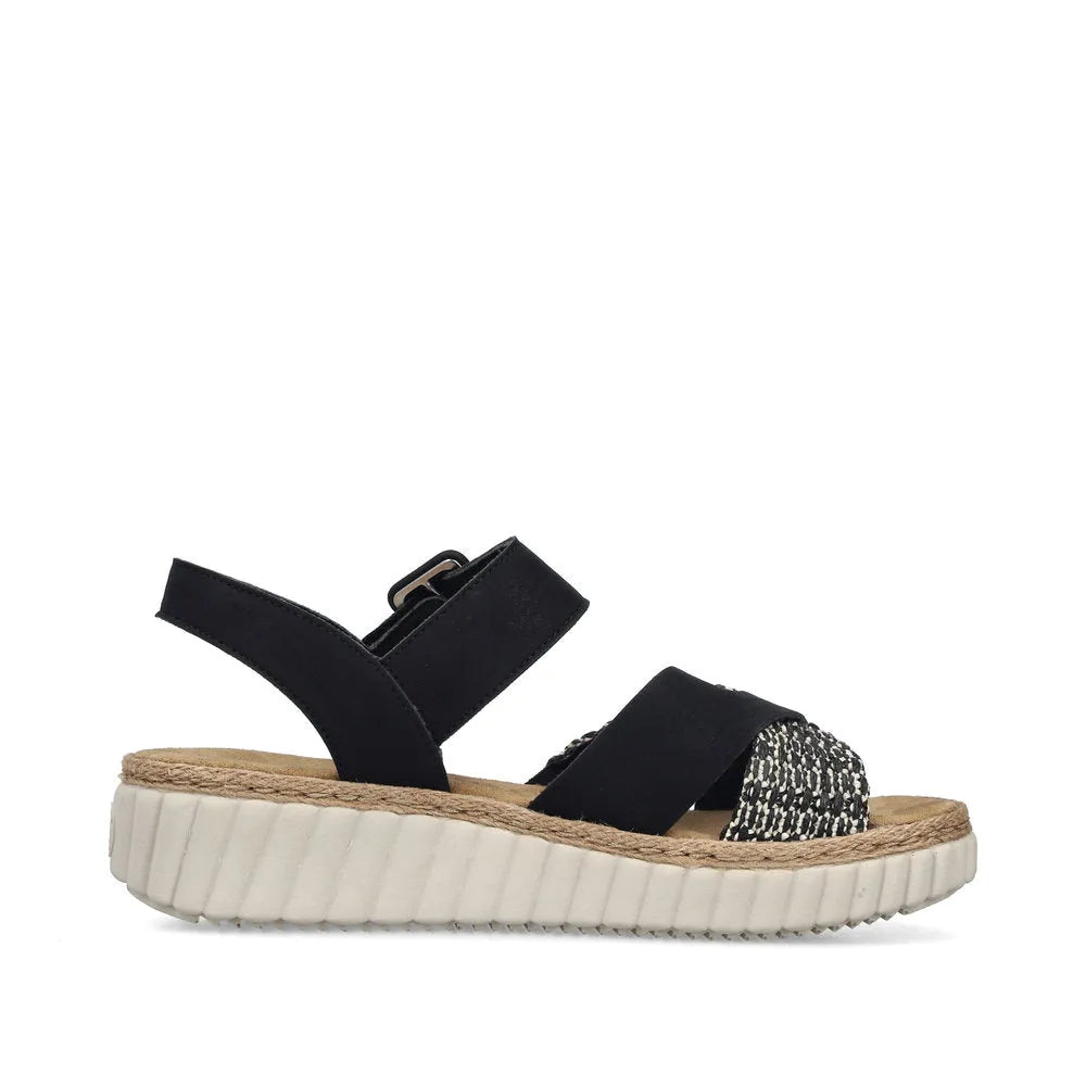 Rieker 69269-00 women's wide black touch fastening sandals with textured front strap and chunky white sole.