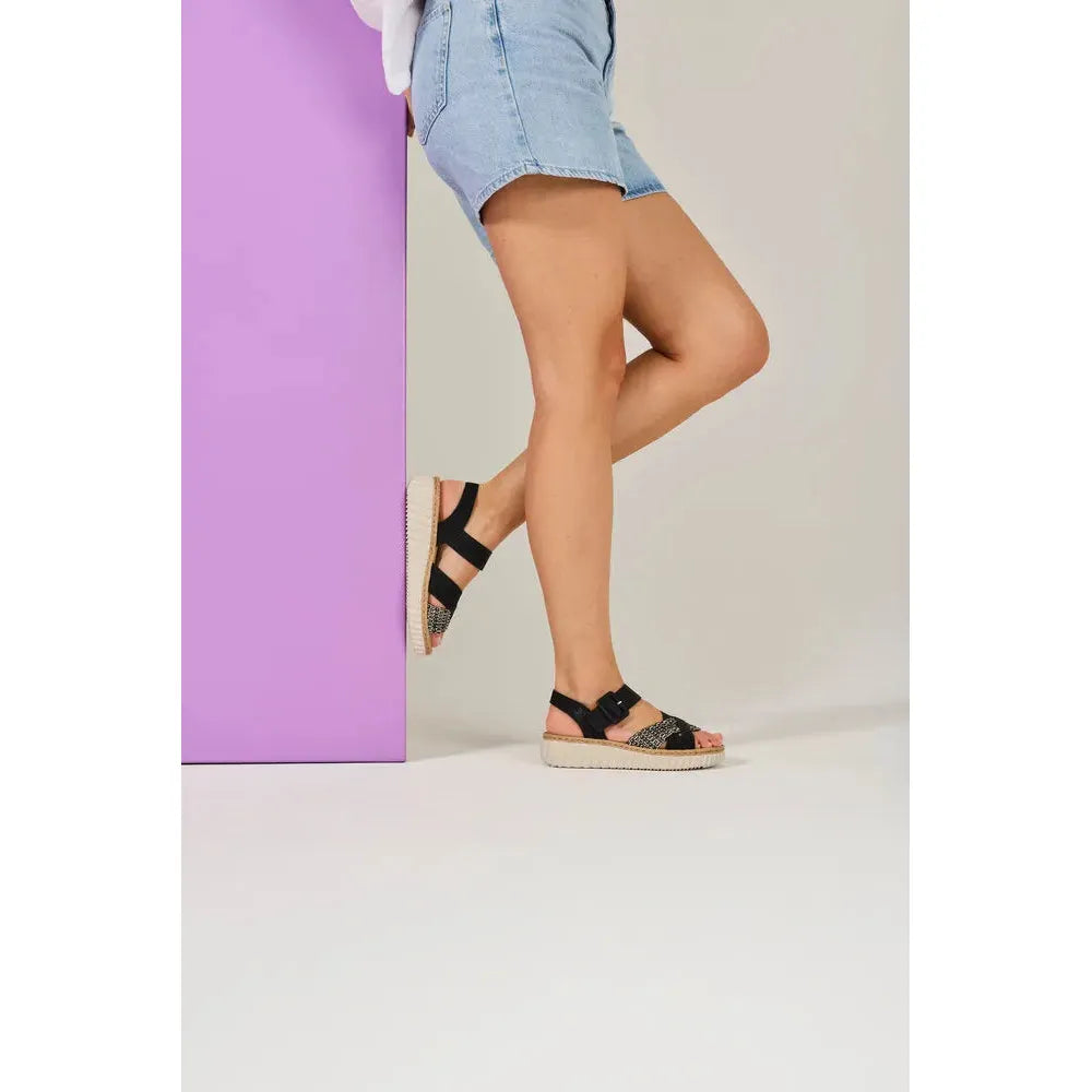 Rieker 69269-00 Ladies Wide Black Touch Fastening Sandals with striped straps and beige sole.