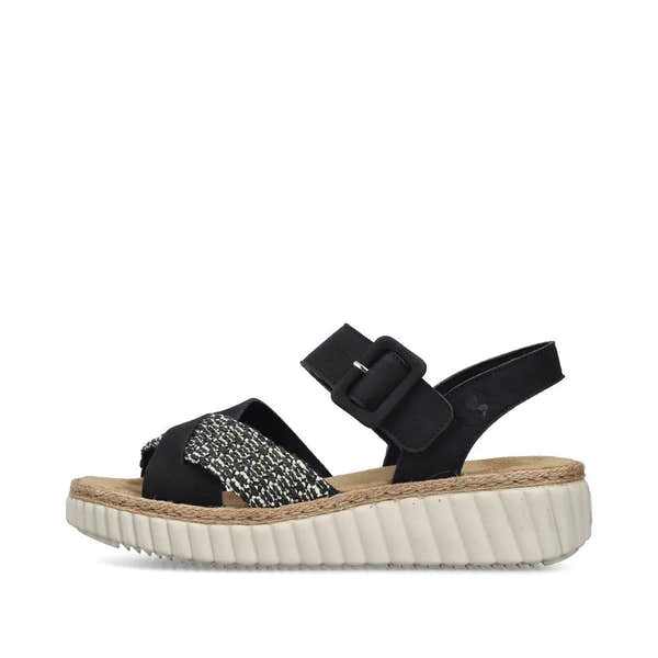 Rieker 69269-00 women's wide fit black touch fastening sandals with woven straps and a chunky white sole.