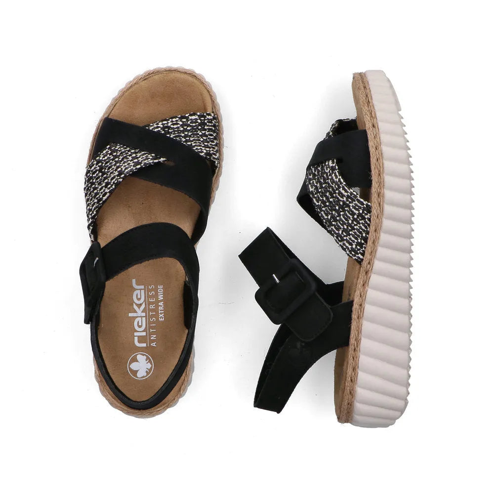 Rieker 69269-00 women's wide black touch fastening sandals with patterned straps and thick beige sole.