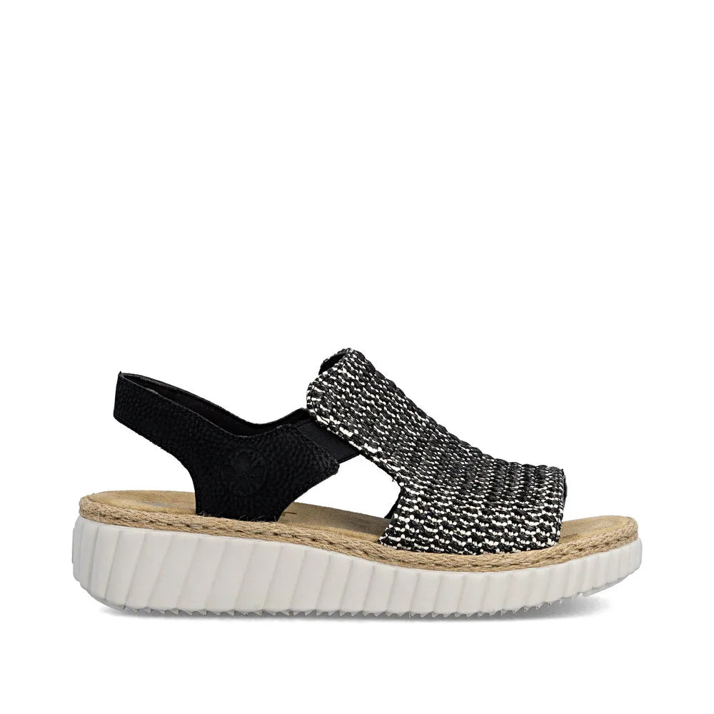 Rieker 69276-00 ladies wide fit black textile elasticated sandals with a cushioned sole and textured strap design.