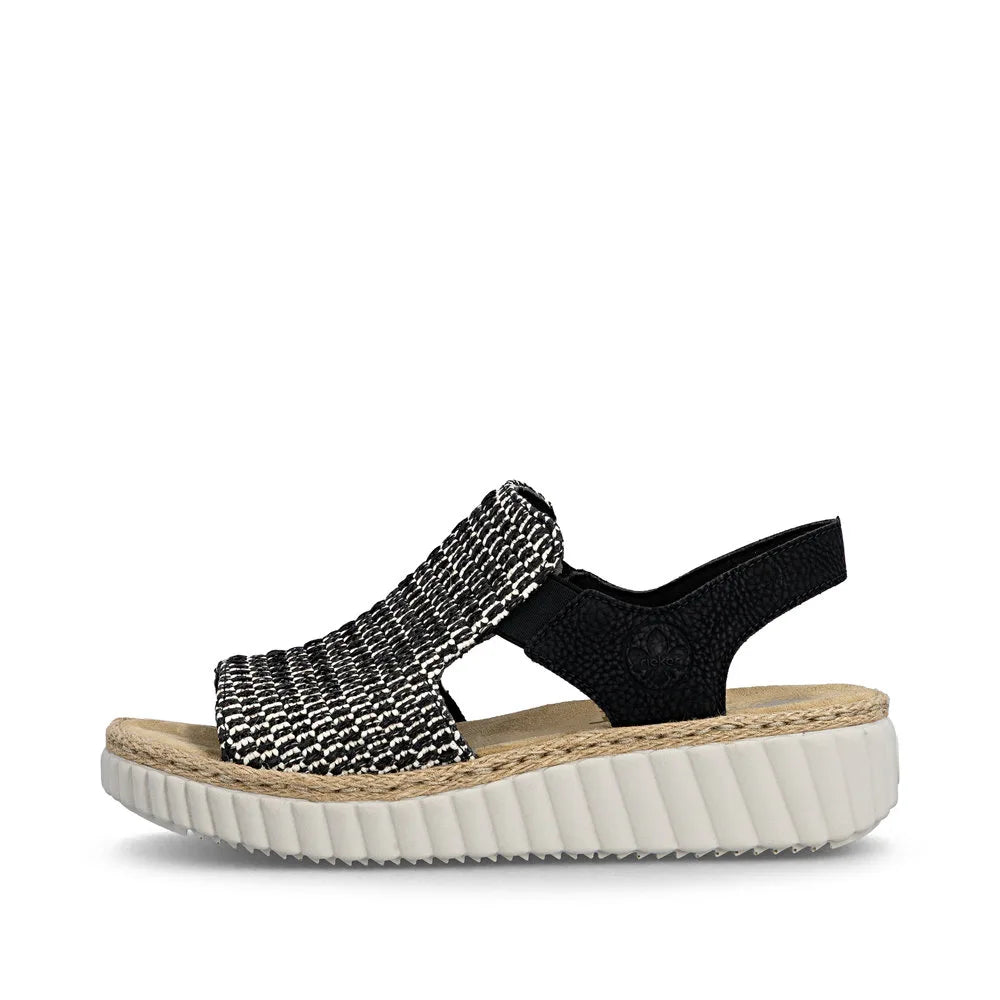 Rieker 69276-00 women's wide black textile elasticated sandals with cushioned footbed and chunky white sole.
