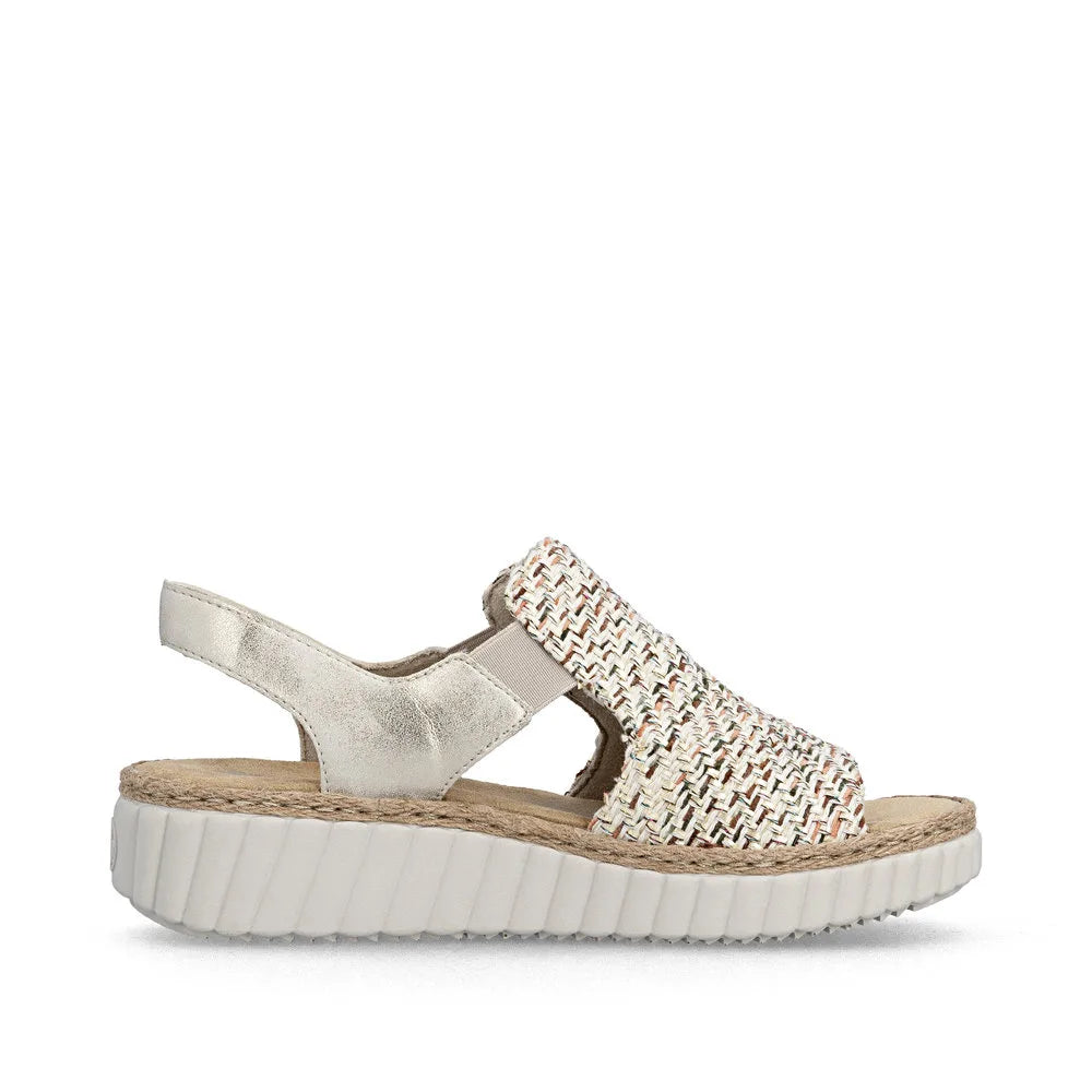 Rieker 69276-60 beige wide ladies elasticated textile sandal with cushioned sole and velcro strap.