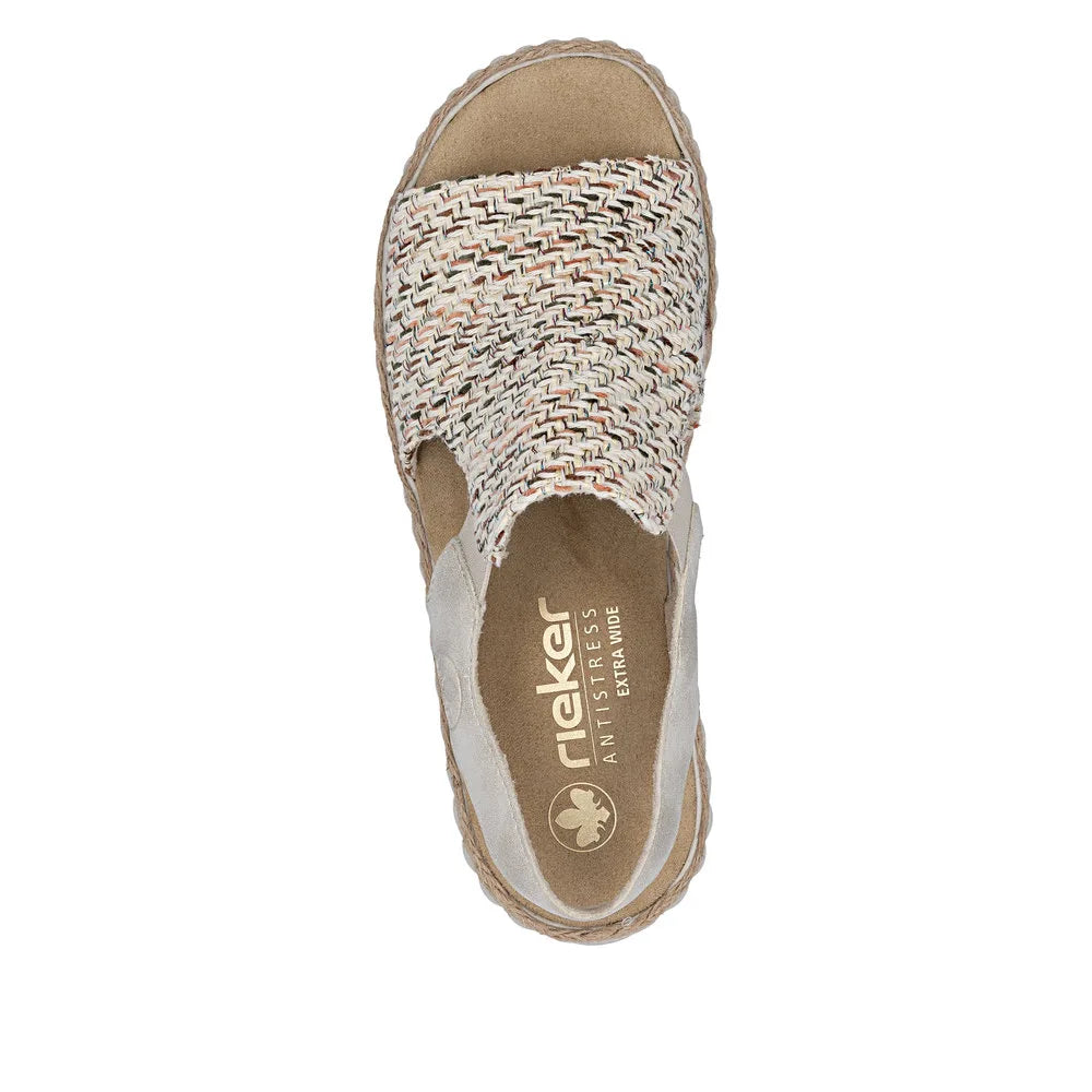 Rieker 69276-60 women's wide beige textile elasticated slip-on sandals with woven upper and cushioned insole.