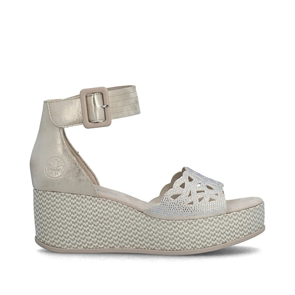 Rieker 69457-60 women's beige wedge sandals with buckle strap and cutout design, lightweight and stylish for summer wear.